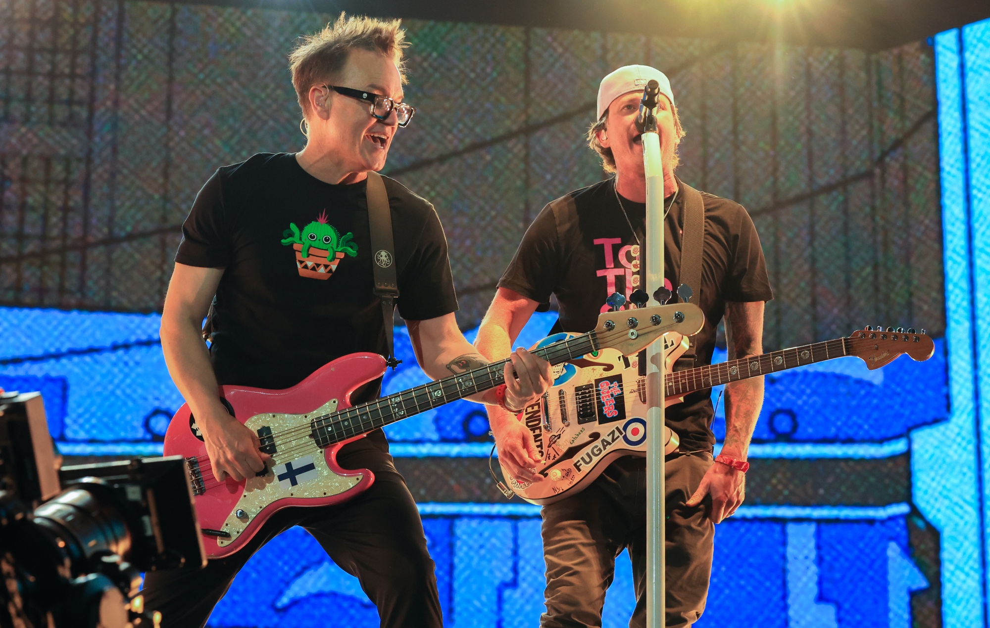 Mark Hoppus and Tom DeLonge performing live on stage with Blink-182