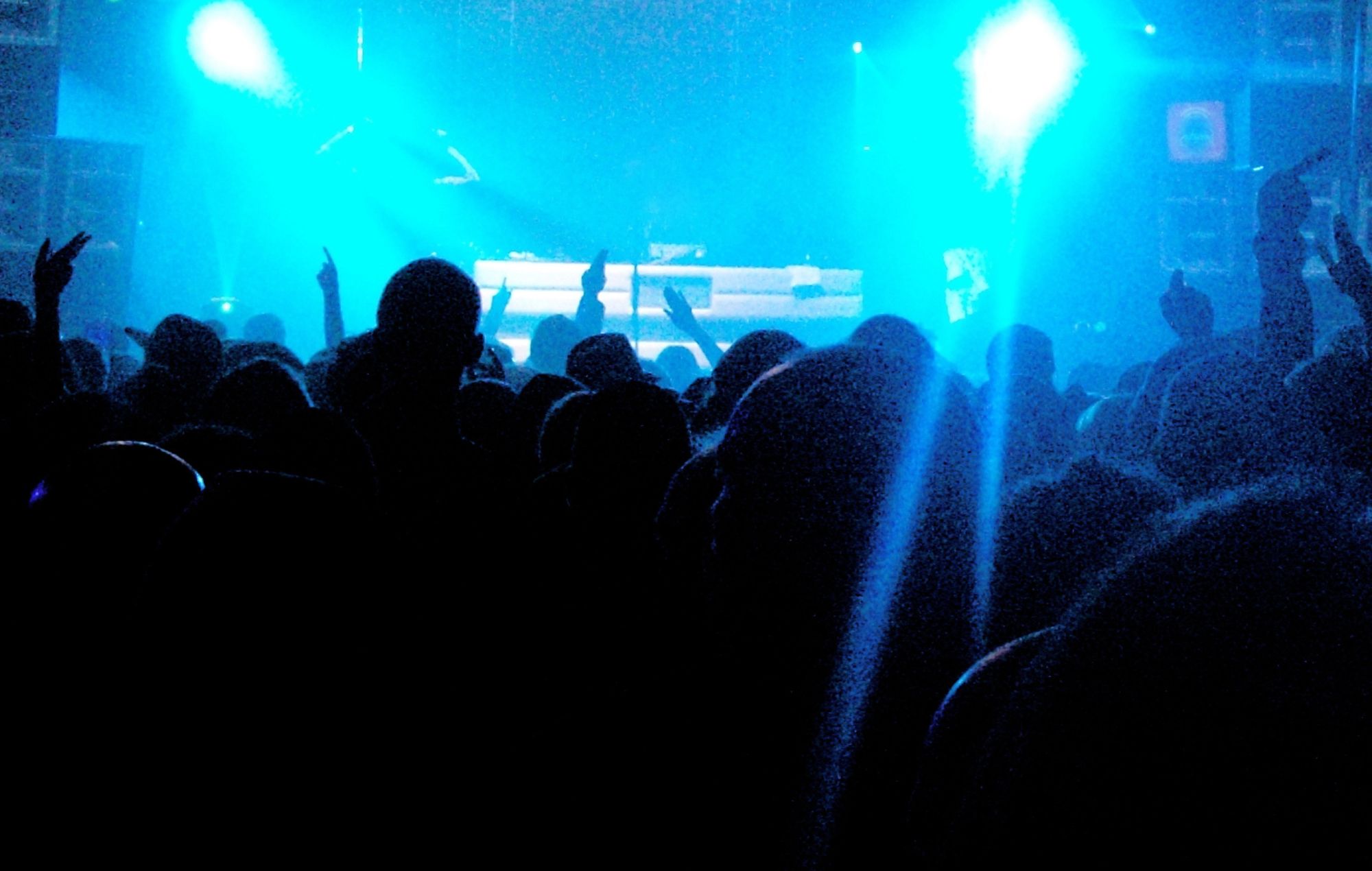 A large energetic crowd at a music gig