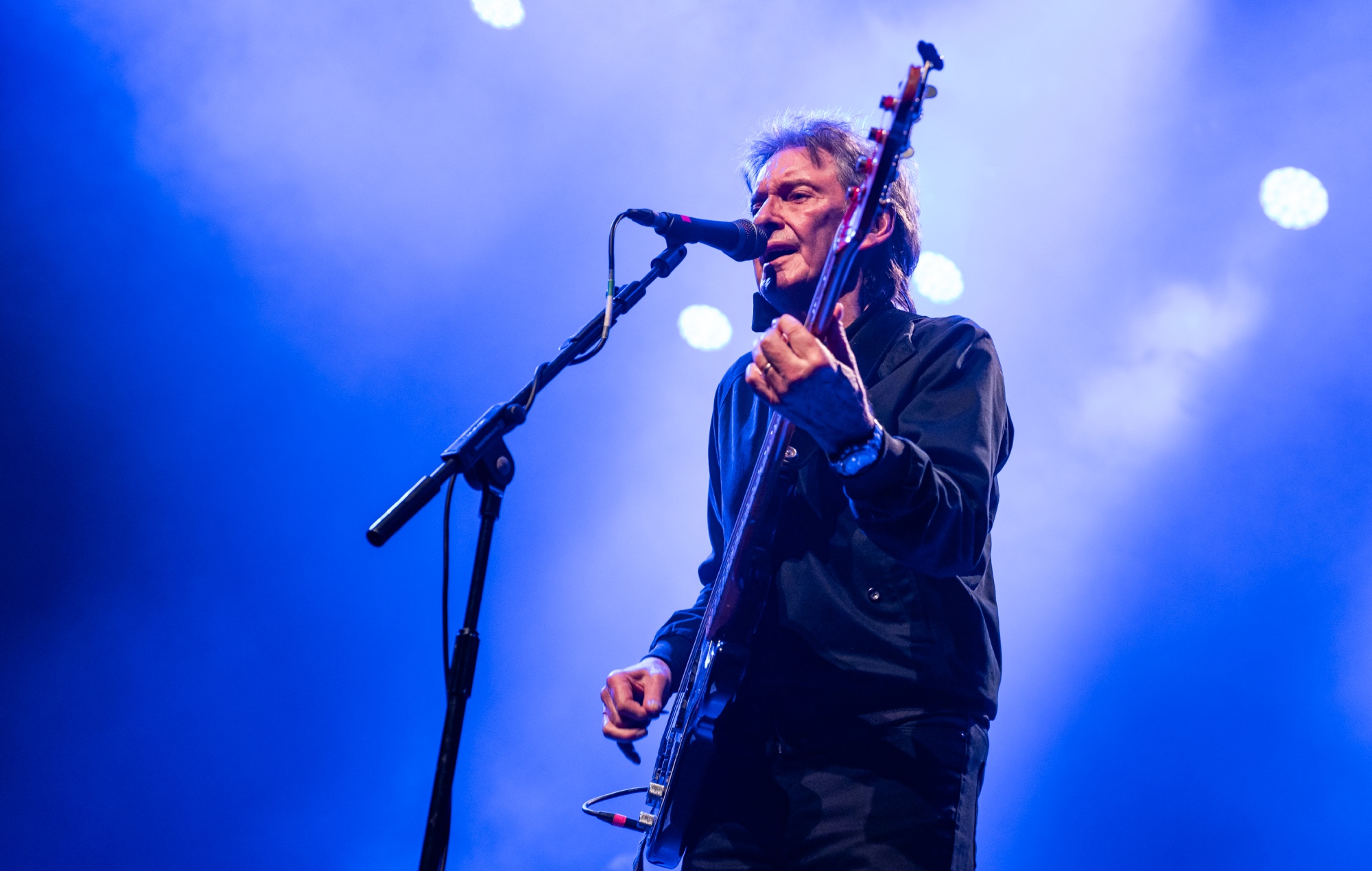 Bruce Foxton performing live on stage, photo by Lorne Thomson/Redferns/Getty