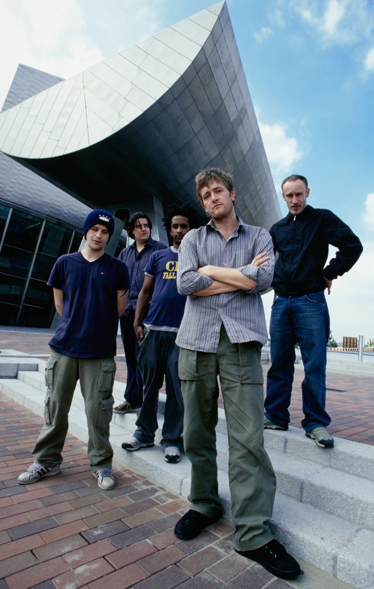 Elbow outside The Lowry arts centre at Salford Quays, in Salford, Greater Manchester, England, 2001. (Photo by Simon King/Redferns/Getty Images)