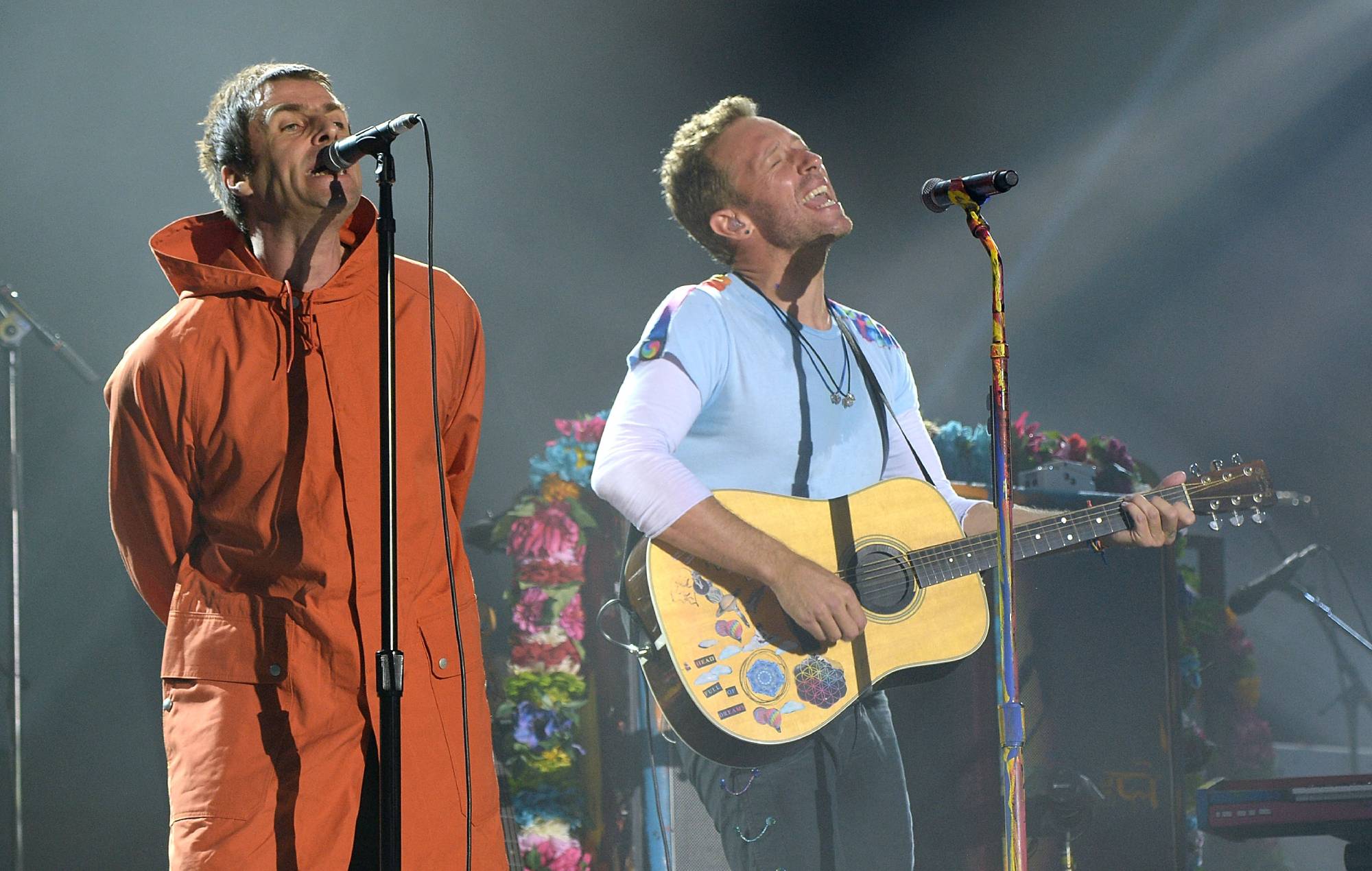 Liam Gallagher (L) and Chris Martin of Coldplay