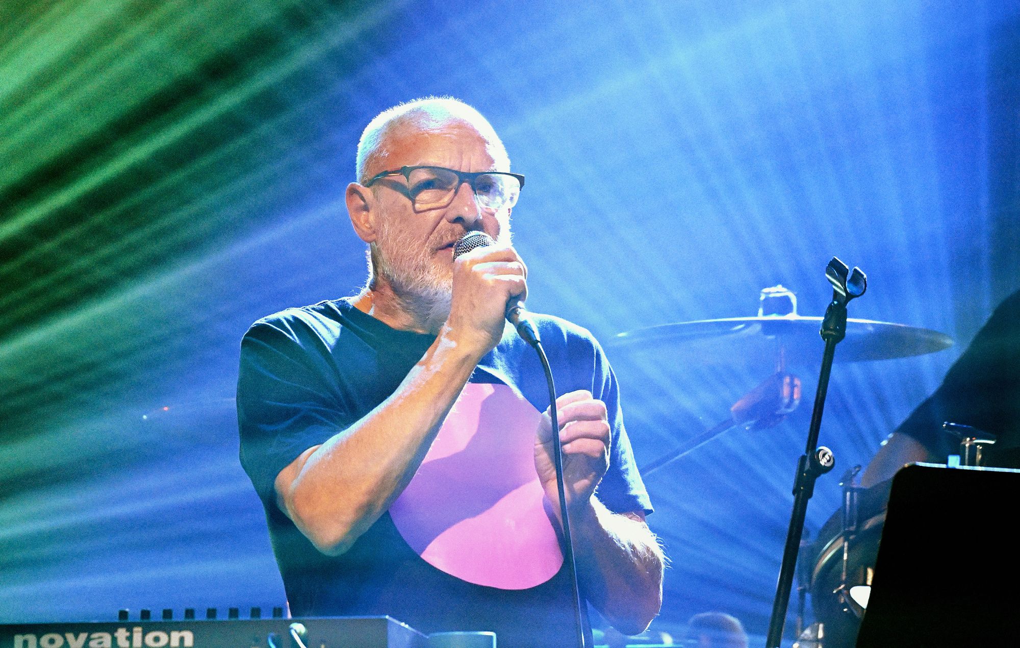 Brian Eno performs on stage