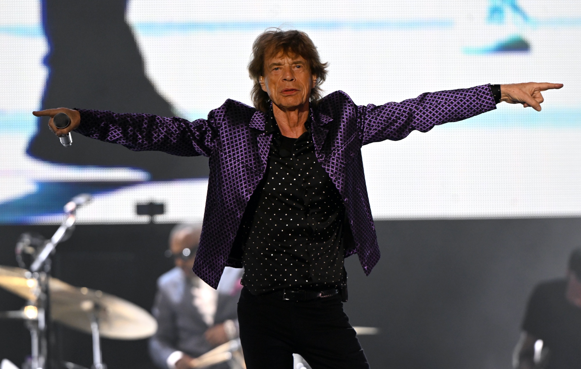 Mick Jagger performing live on stage with The Rolling Stones, photo by  Helen H. Richardson/MediaNews Group/The Denver Post/Getty