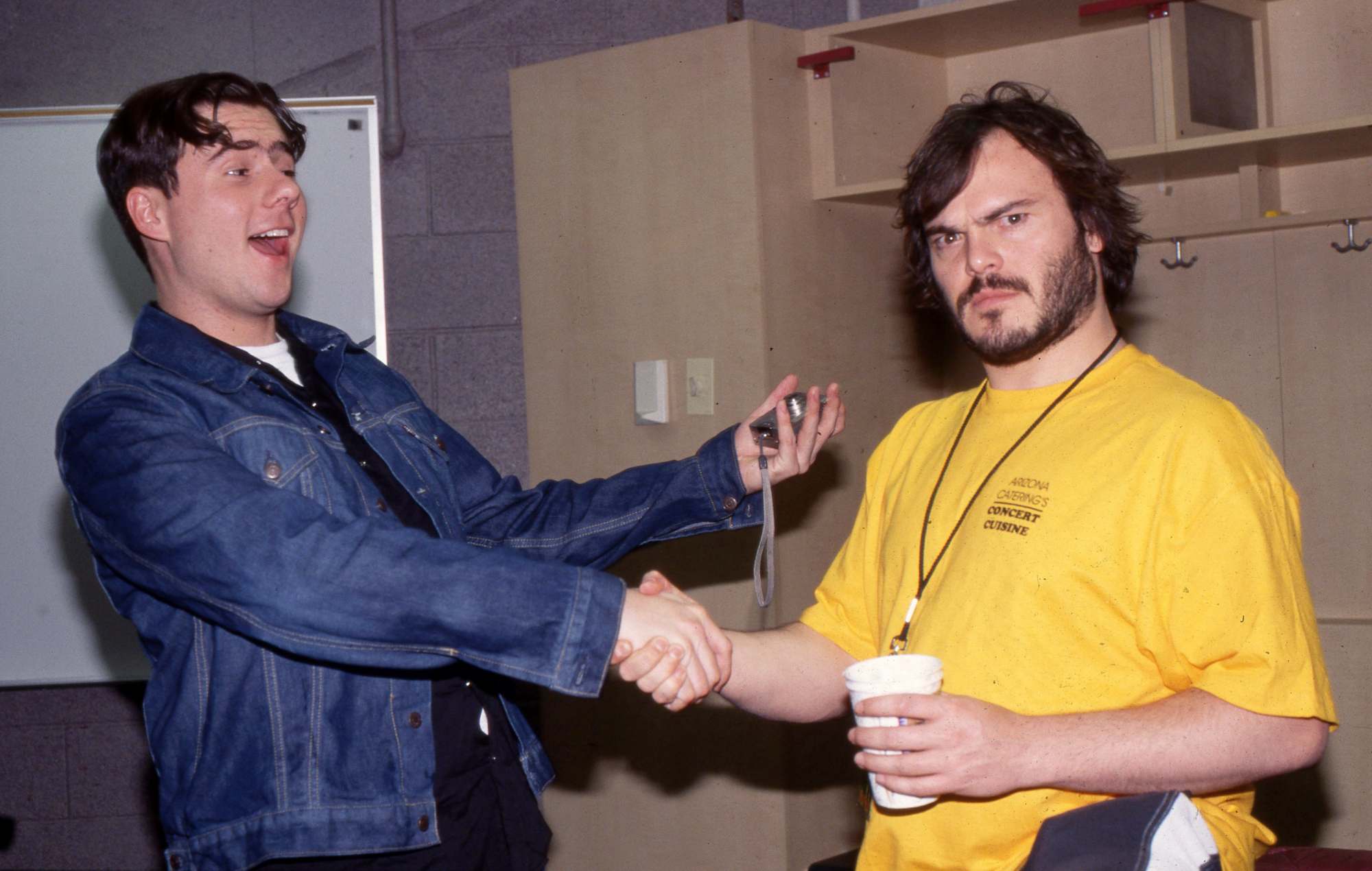 Jack Black with Jim Adkins of Jimmy Eat World backstage, 2001. (Photo by Martyn Goodacre/Getty Images)