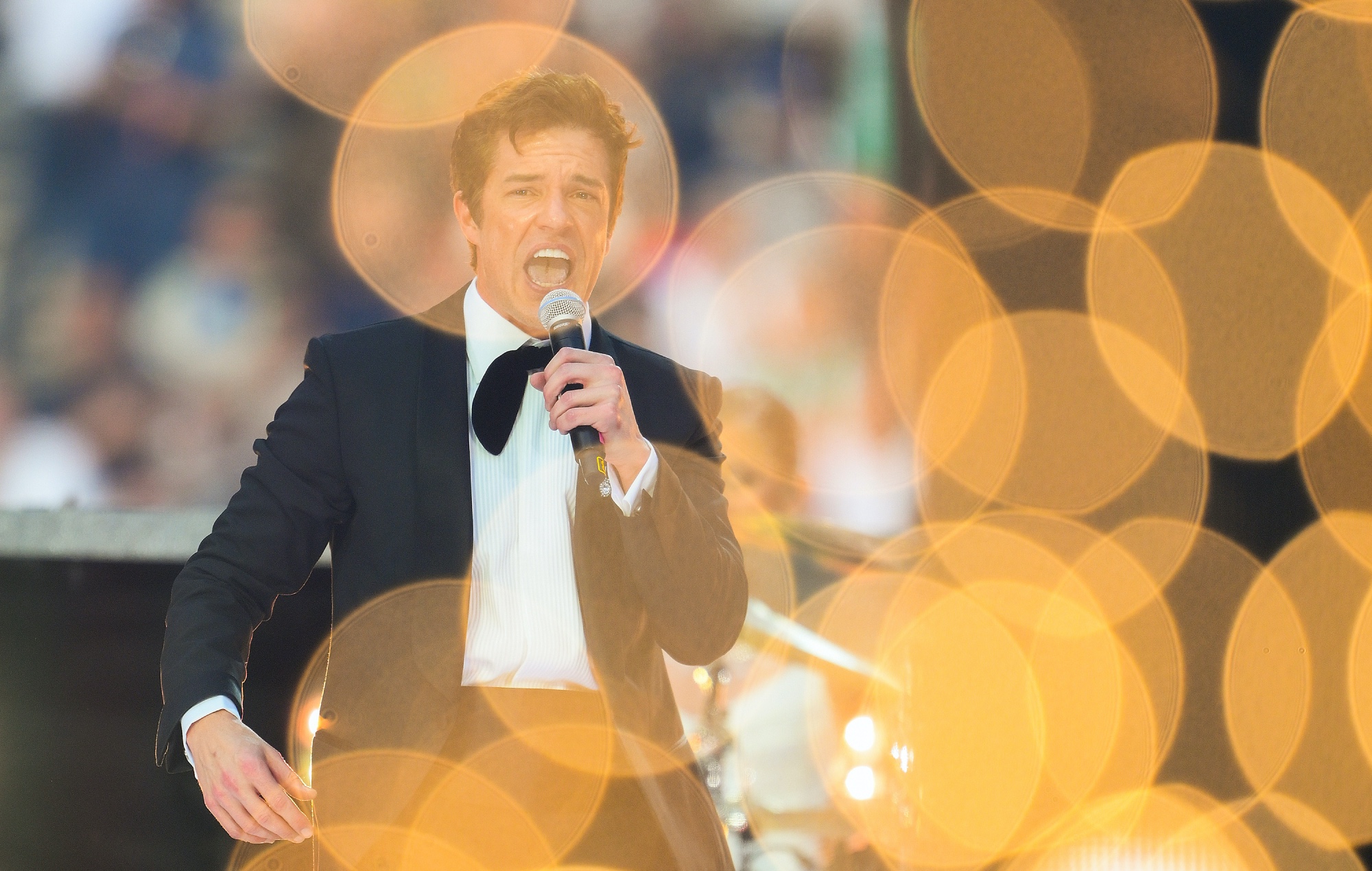 Brandon Flowers performing live on stage, photo by David Ramos/Getty