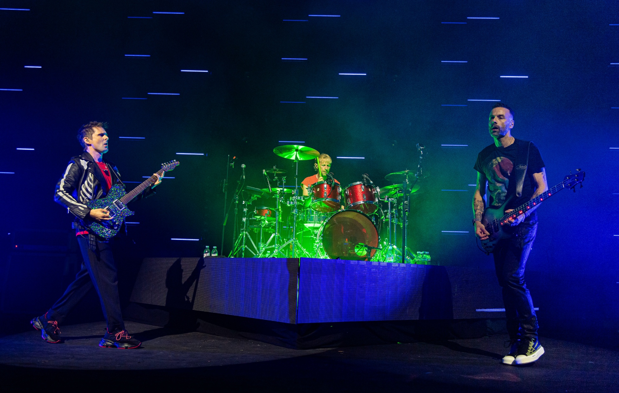 Muse performing live on stage, photo by Joseph Okpako/WireImage/Getty