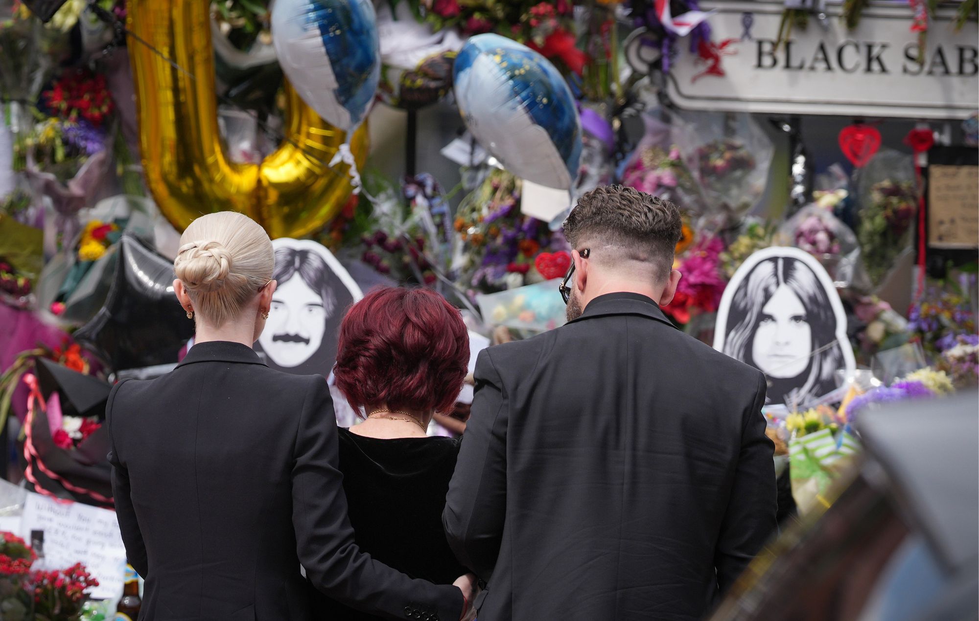 Kelly Osbourne, Sharon Osbourne and Jack Osbourne with tributes to the late Ozzy Osbourne in Birmingham