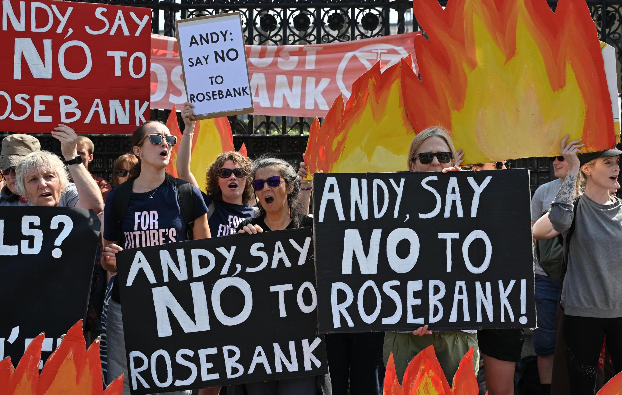 Climate activists from Fossil Free London stage a protest outside the Houses of Parliament Credit: Andrea Domeniconi / Fossil Free London