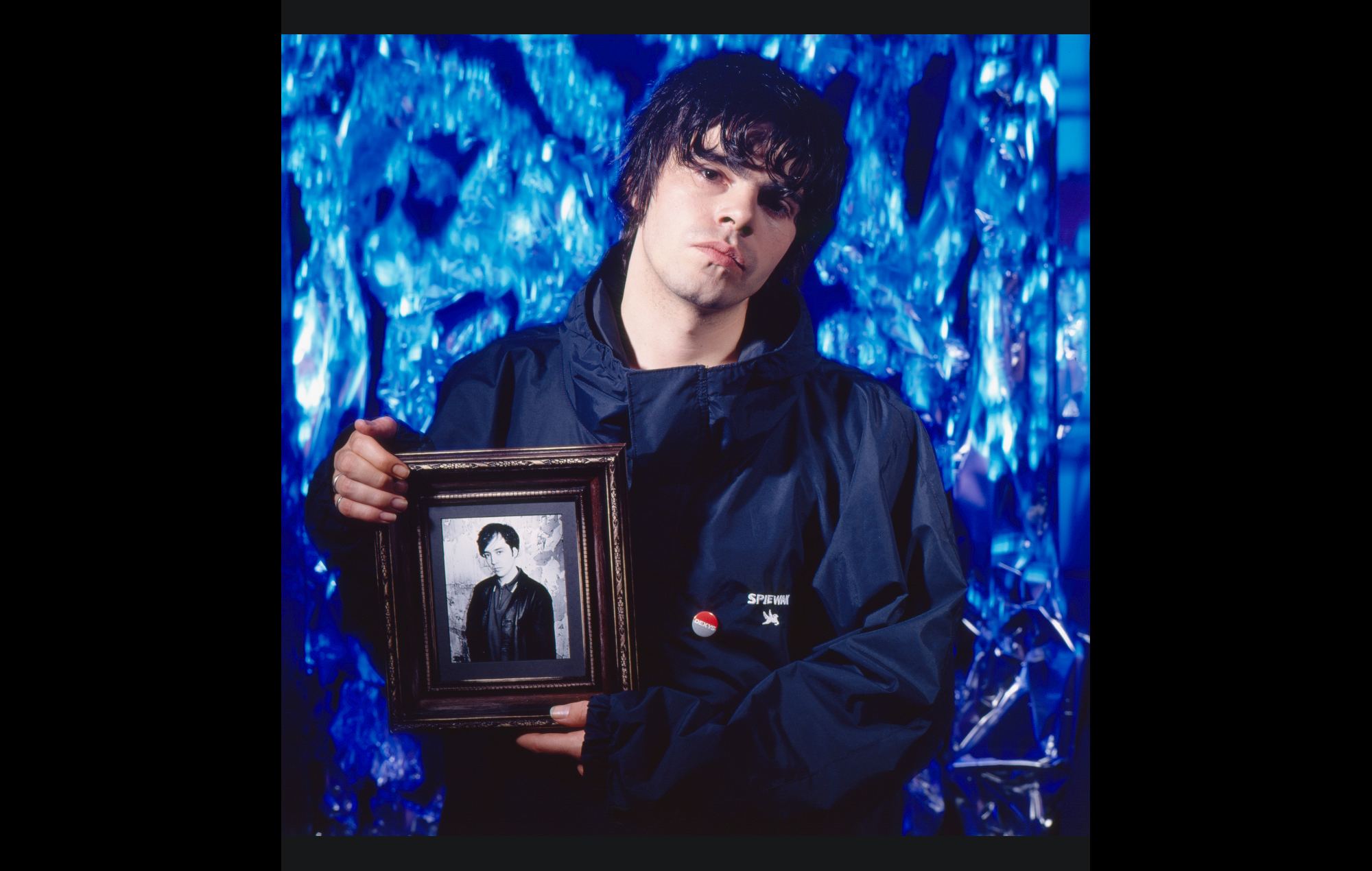 The Charlatans' Tim Burgess with a photo of the late Rob Collins. Credit: Tom Sheehan