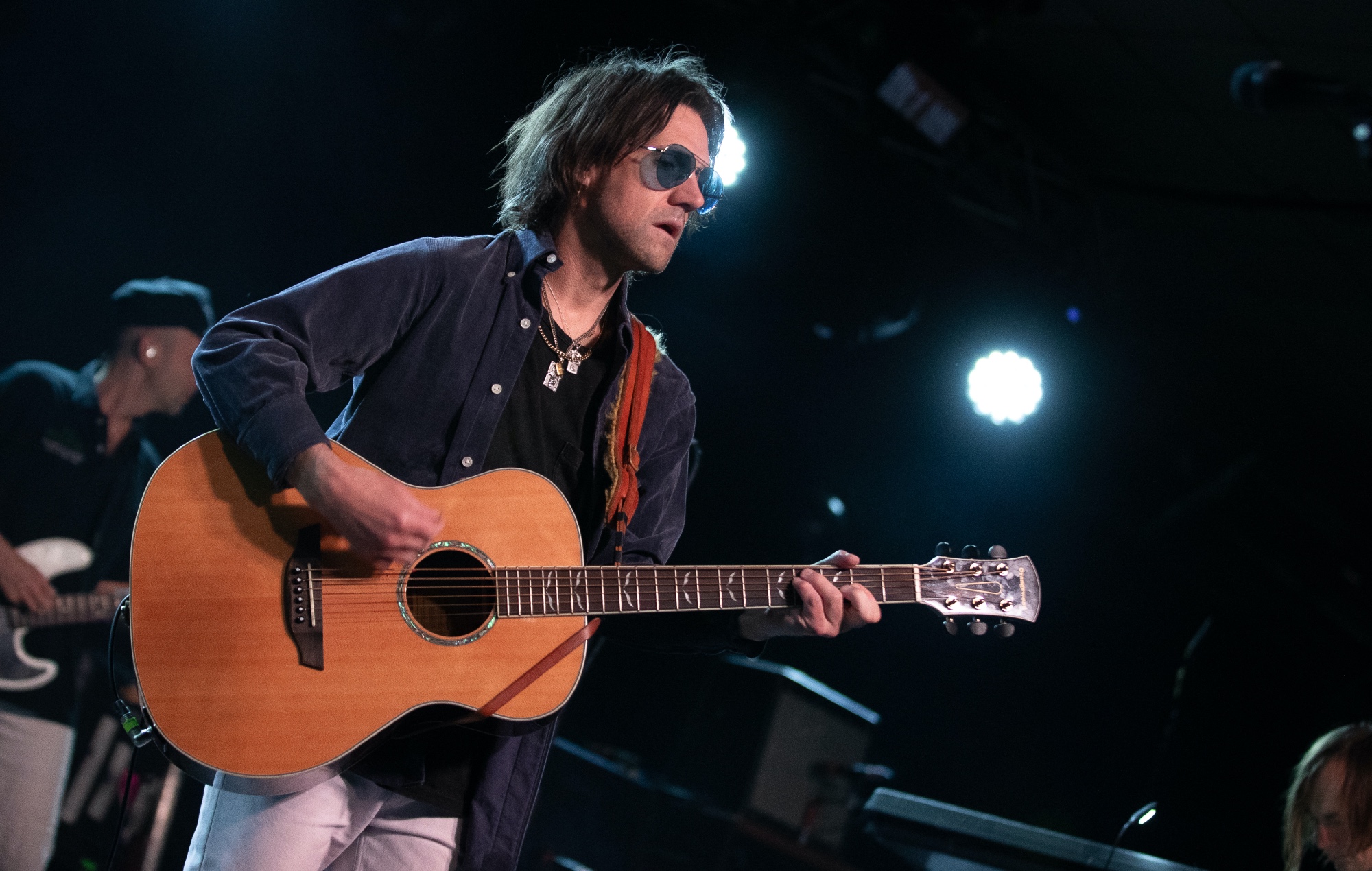 Conor Oberst performing live on stage, photo by Kieran Frost/Redferns/Getty