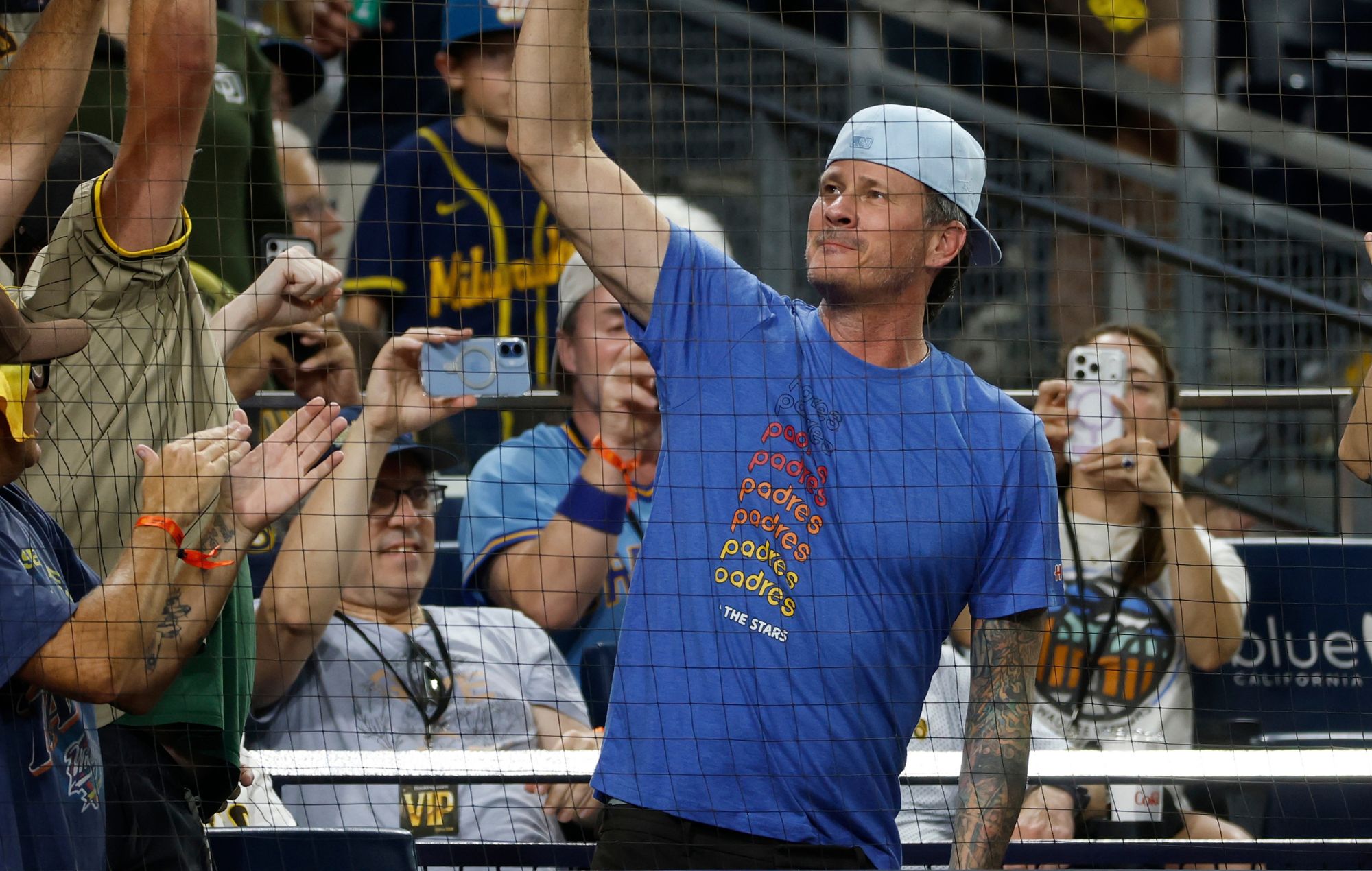Tom DeLonge of blink-182 cheers on the San Diego Padres