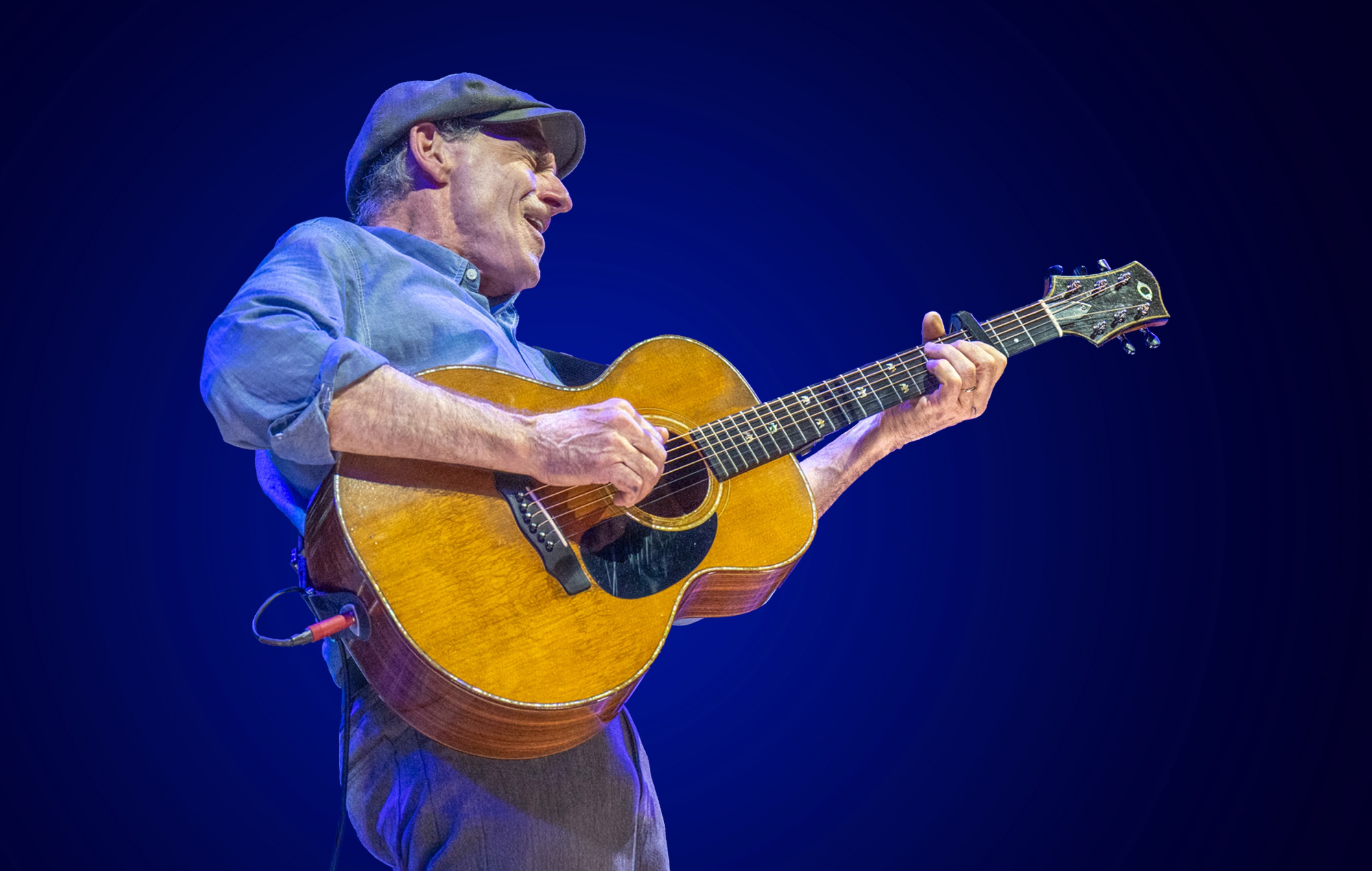 James Taylor performing live on stage
