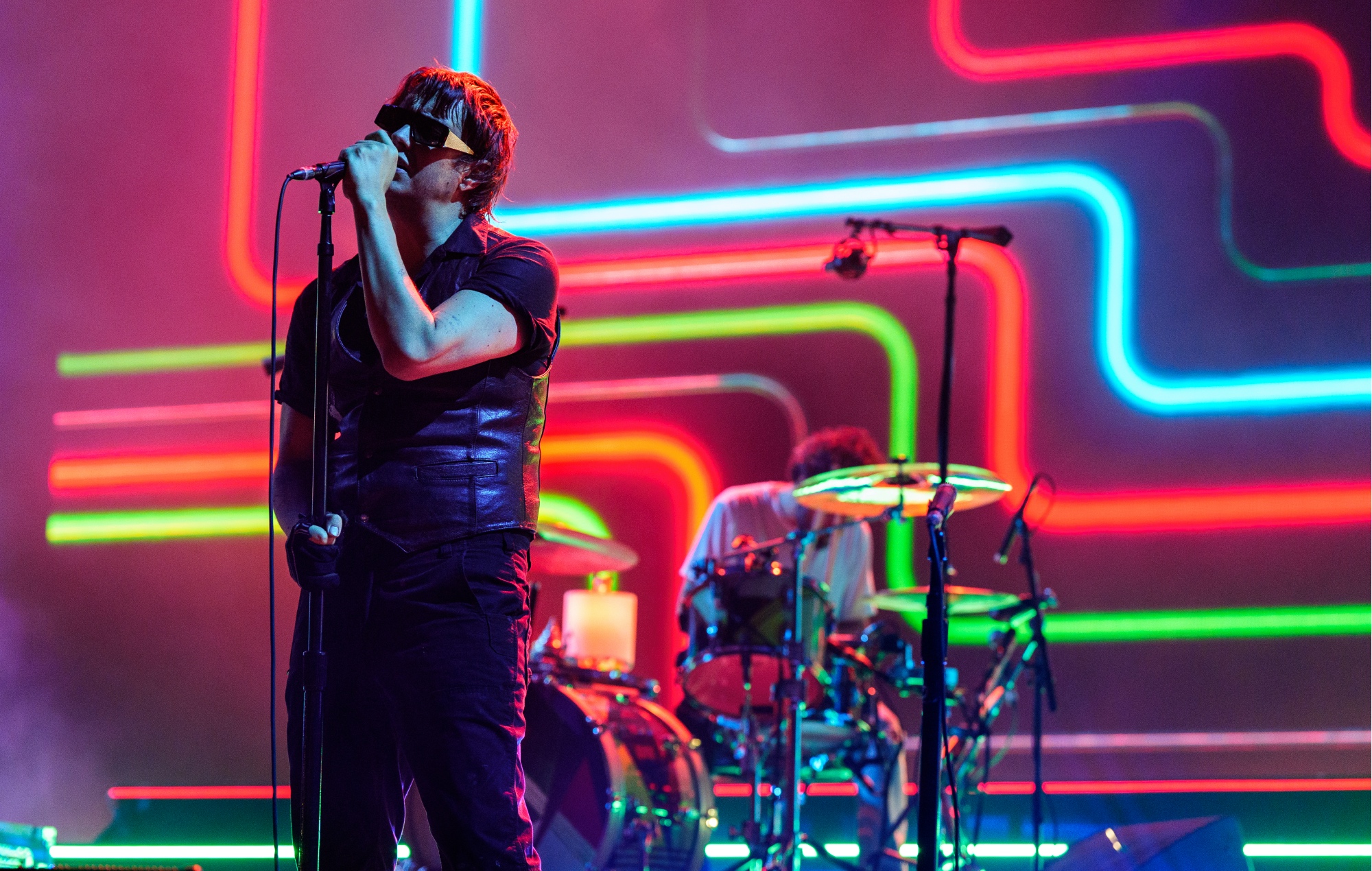 The Strokes performing live on stage, photo by Erika Goldring/Getty
