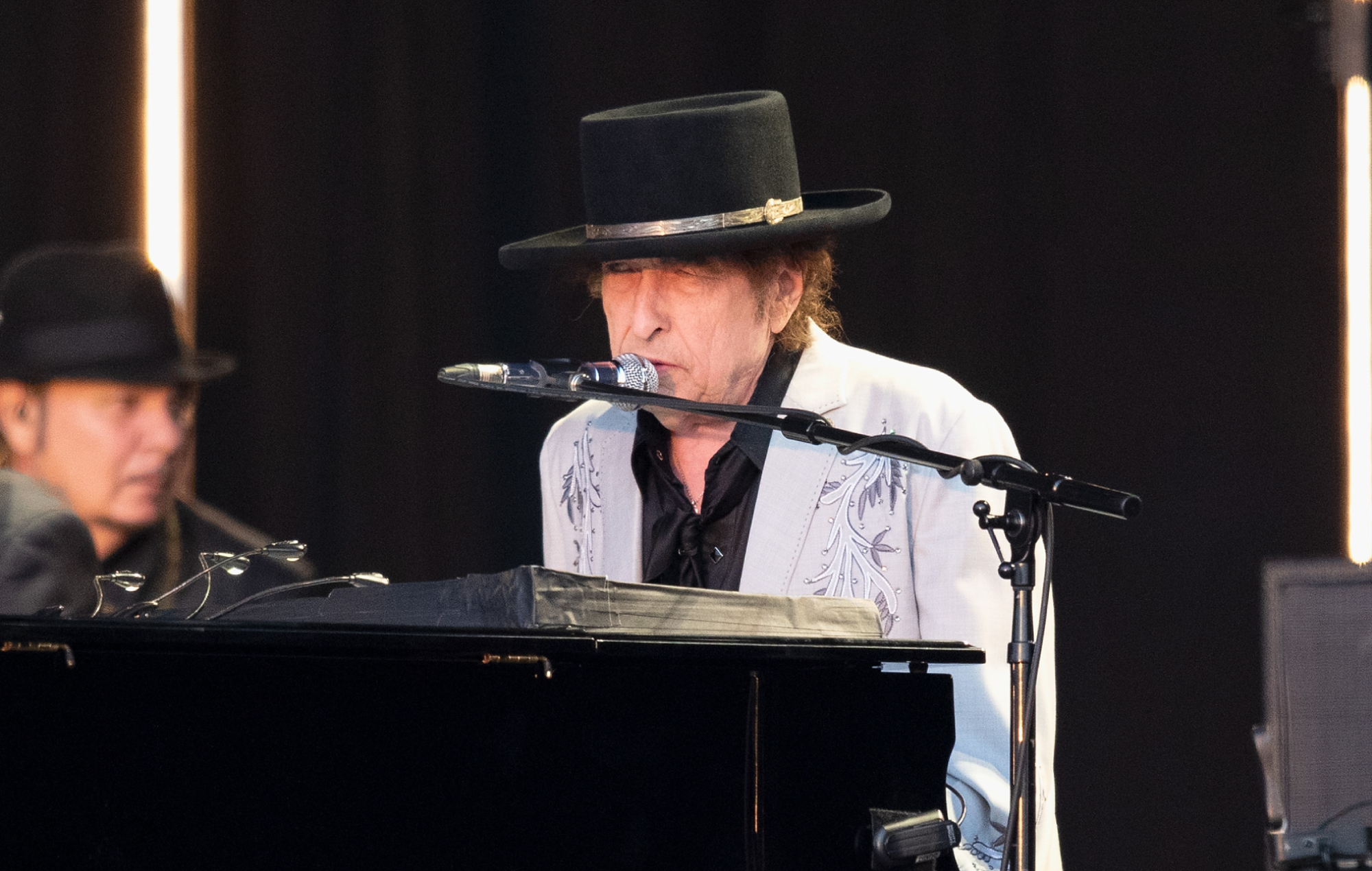 Bob Dylan performing live on stage, photo by Jo Hale/Redferns/Getty