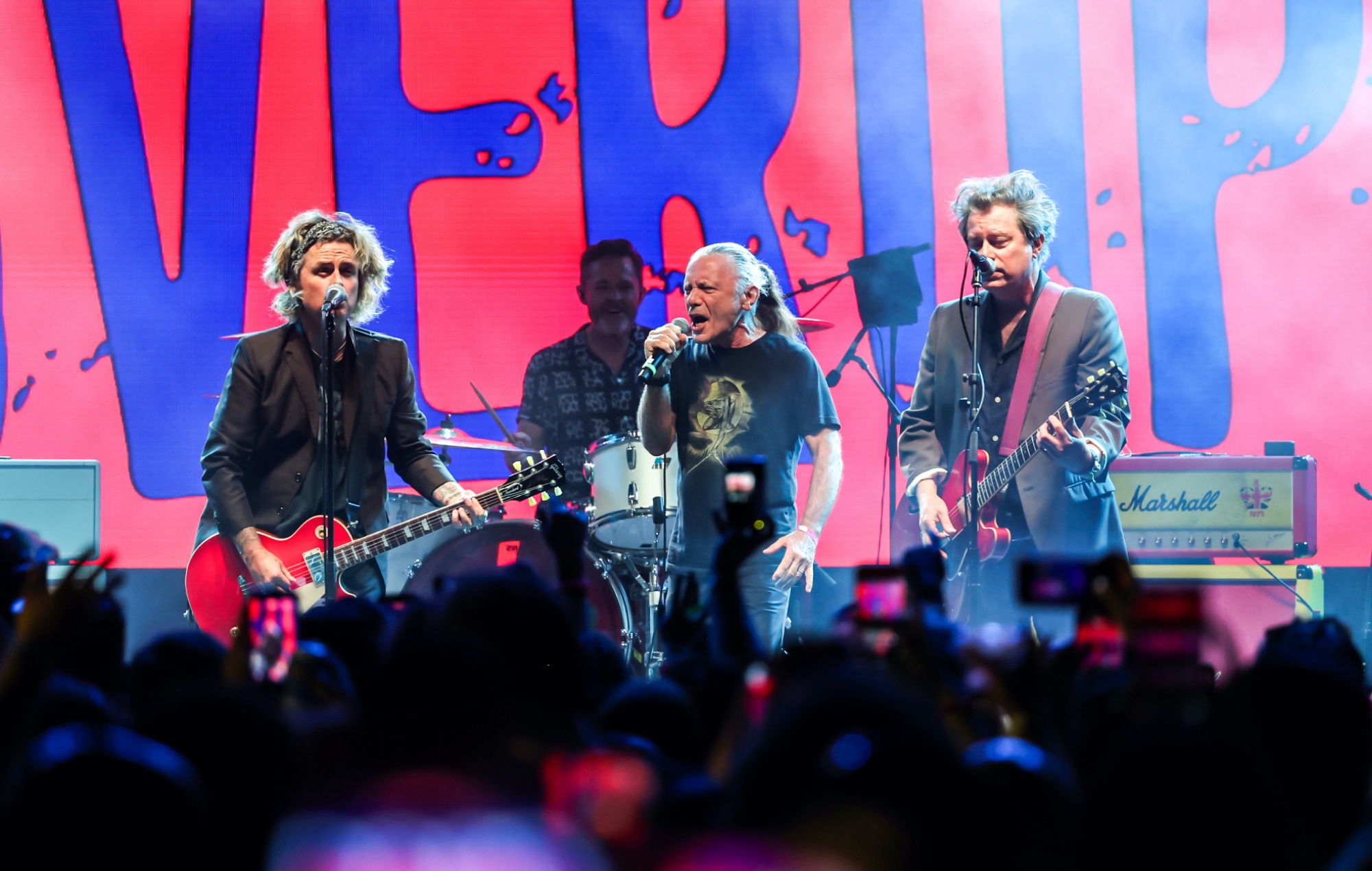The Coverups performing live on stage with Bruce Dickinson, photo by Phillip Faraone/Getty