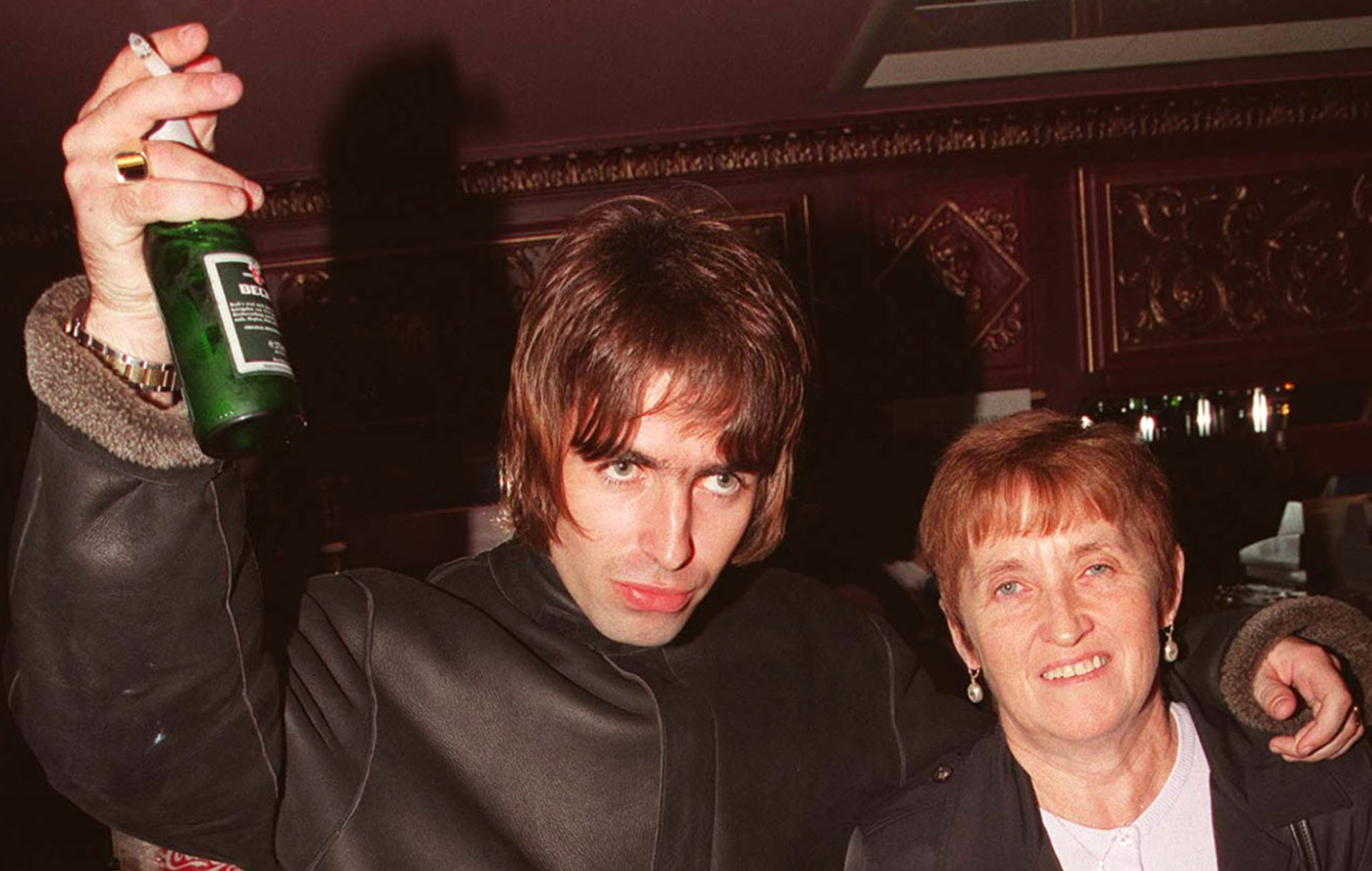 Liam Gallagher pictured with his mother Peggy, photo by Dave Hogan/Getty