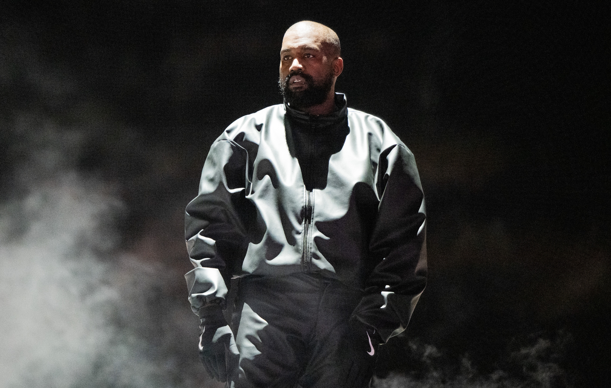 Kanye West performing live on stage, photo by Scott Dudelson/Getty