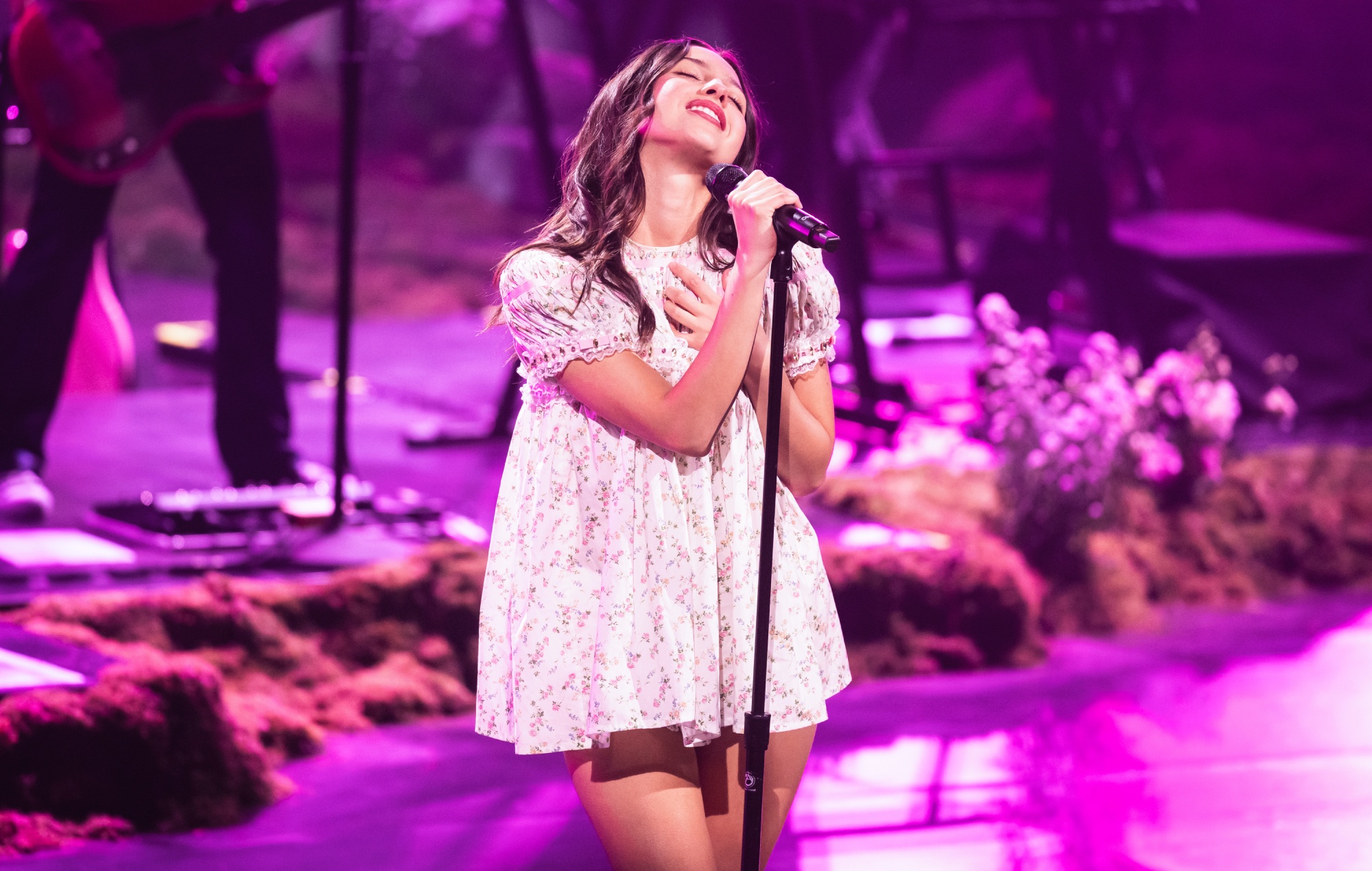 Olivia Rodrigo performing live on stage, photo by Xavi Torrent/Getty Images for Spotify