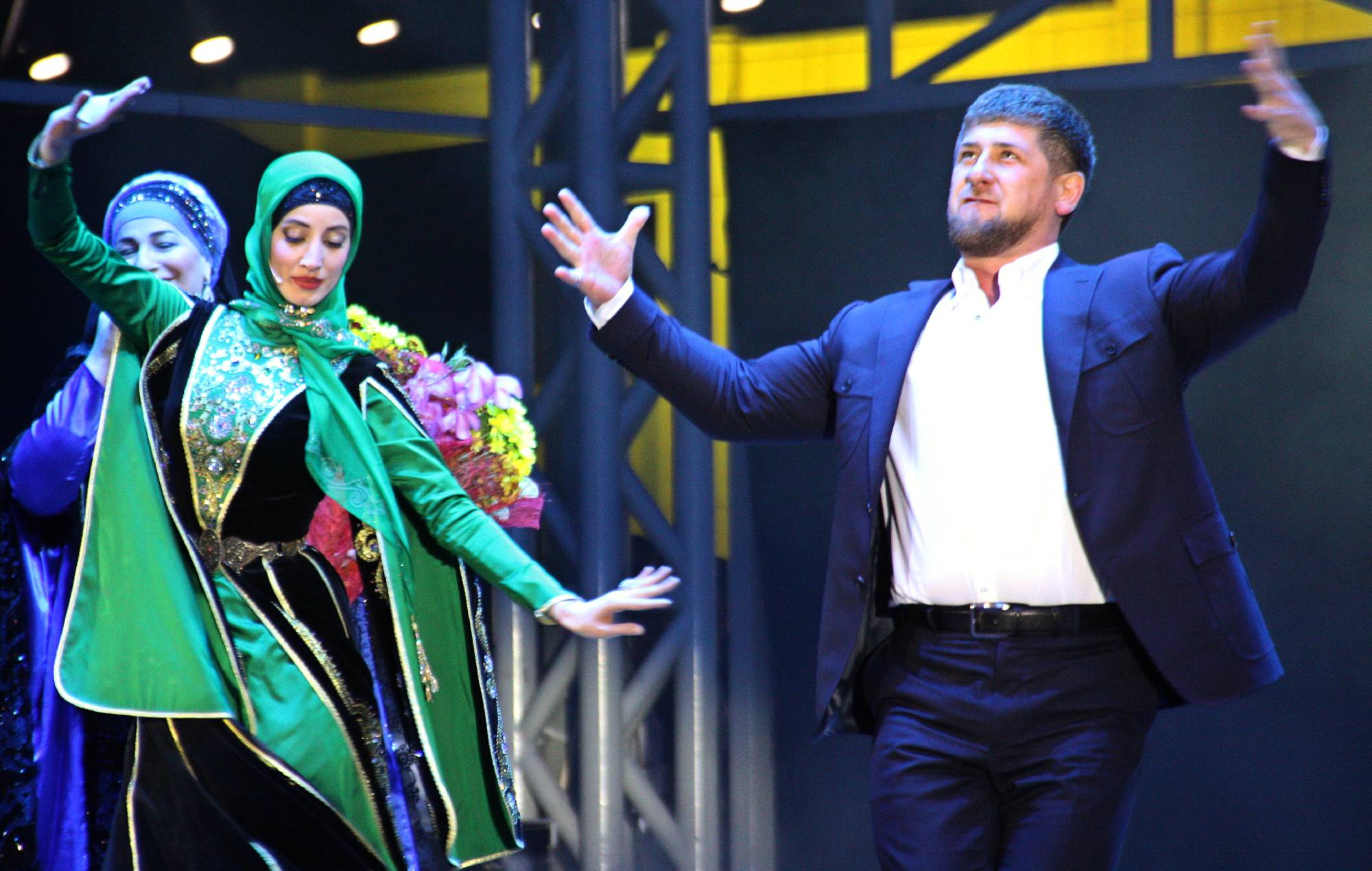 Chechen leader Ramzan Kadyrov (R) dances during a performance in Grozny late on October 5, 2011. (Photo credit should read STR/AFP via Getty Images)