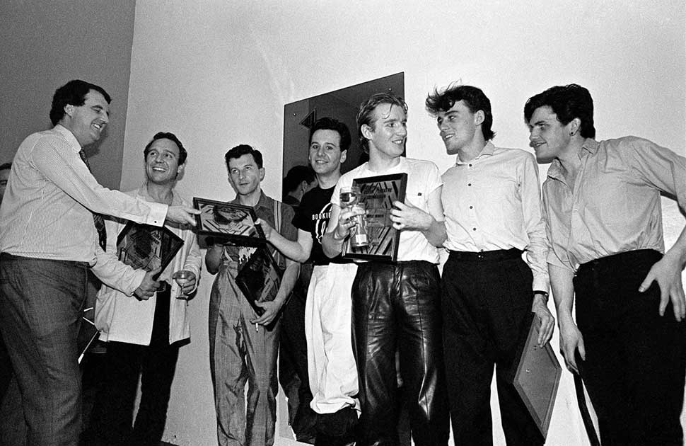 Simple Minds and their manager Bruce Findlay receive plaques backstage to commemorate selling out three nights at Edinburgh Odeon, Scotland, United Kingdom, 27th August 1981